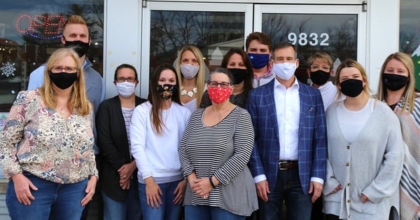 Pharmacy staff in front of pharmacy