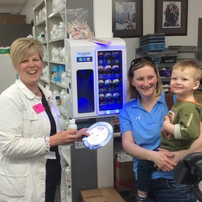 Pharmacist helps child take medicine with FLAVORx